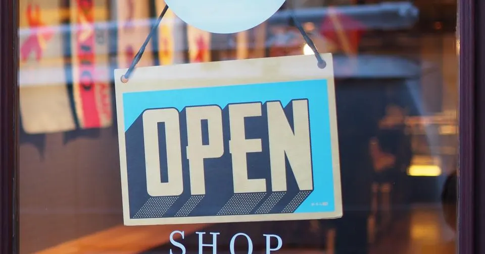 Open sign on a local small business storefront