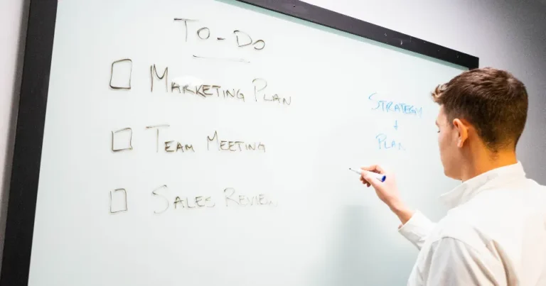 Marketer planning SEO and advertising strategy on a whiteboard