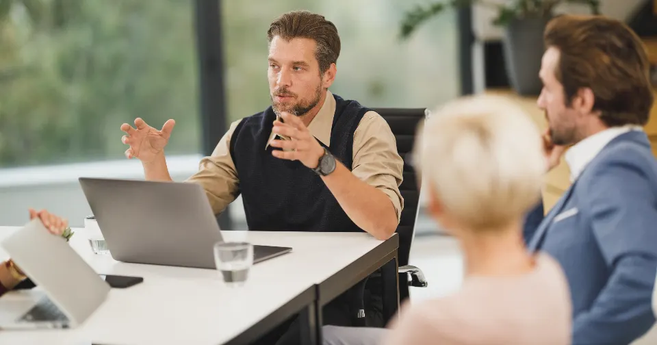 Business owner reviewing SEO results in a meeting with an agency