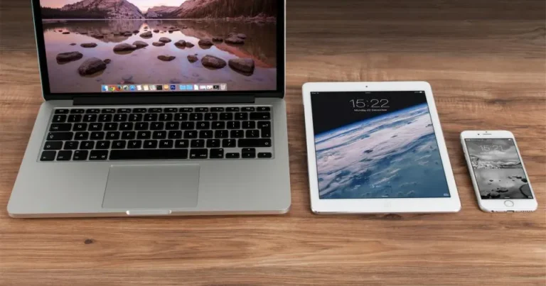 Laptop, tablet, and phone showing a responsive website
