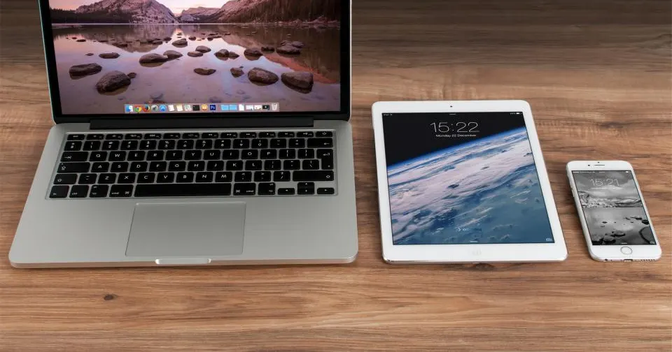 Laptop, tablet, and phone showing a responsive website